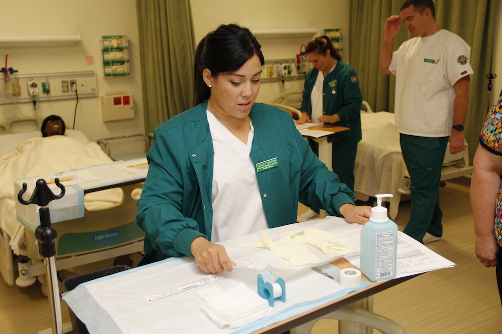 A female medical student lays out medical supplies